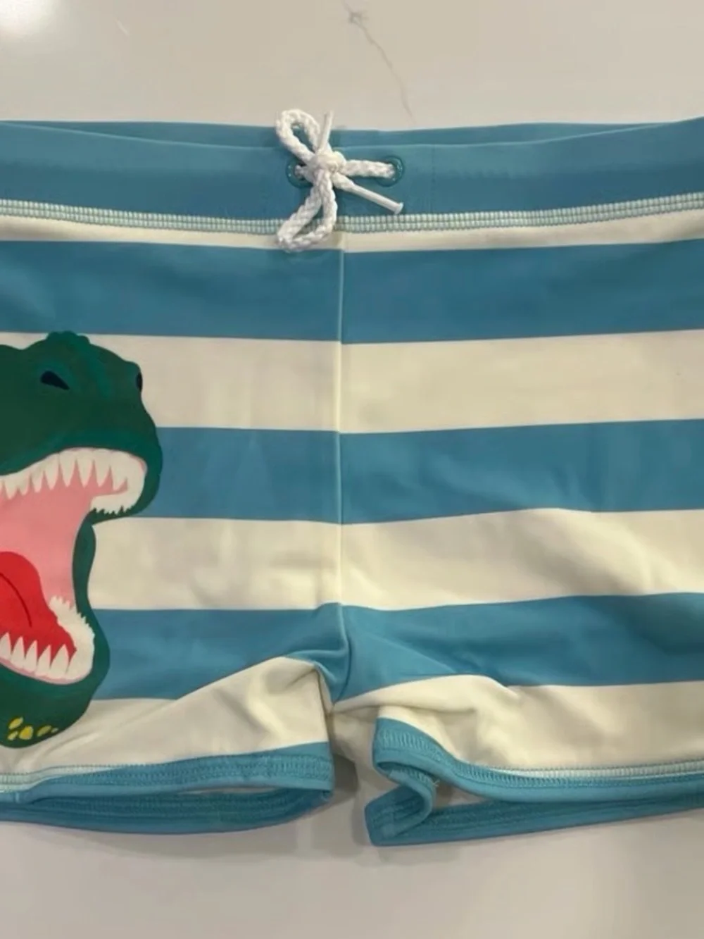 Mini Boden Blue and White Striped Dino Swim Trunks with Drawstring
